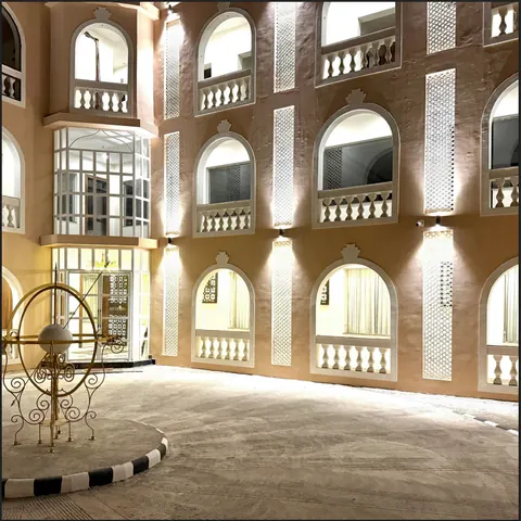 The central atrium ringed by carved arched balconies