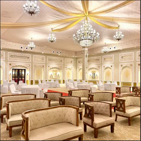 Banquet hall laid out with lounge seating under chandeliers