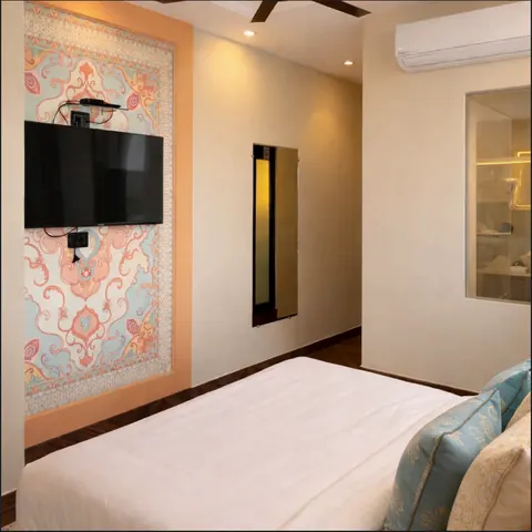 Imperial Family Suite bedroom with a printed feature wall