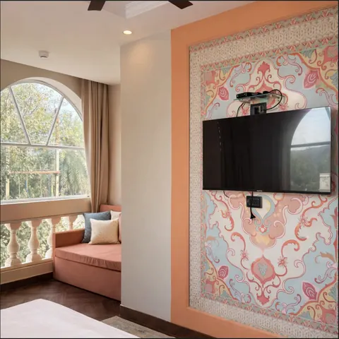 Imperial Family Suite lounge with daybed and arched window