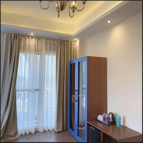 Signature Suite balcony doors dressed with sheer curtains