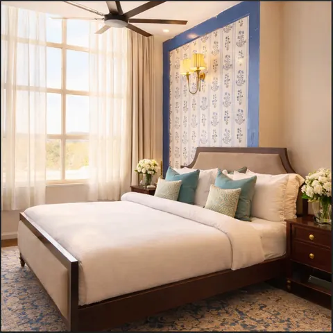 Signature Suite bedroom with a block-print feature wall