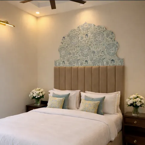 Standard Room bed beneath an arched block-print headboard panel