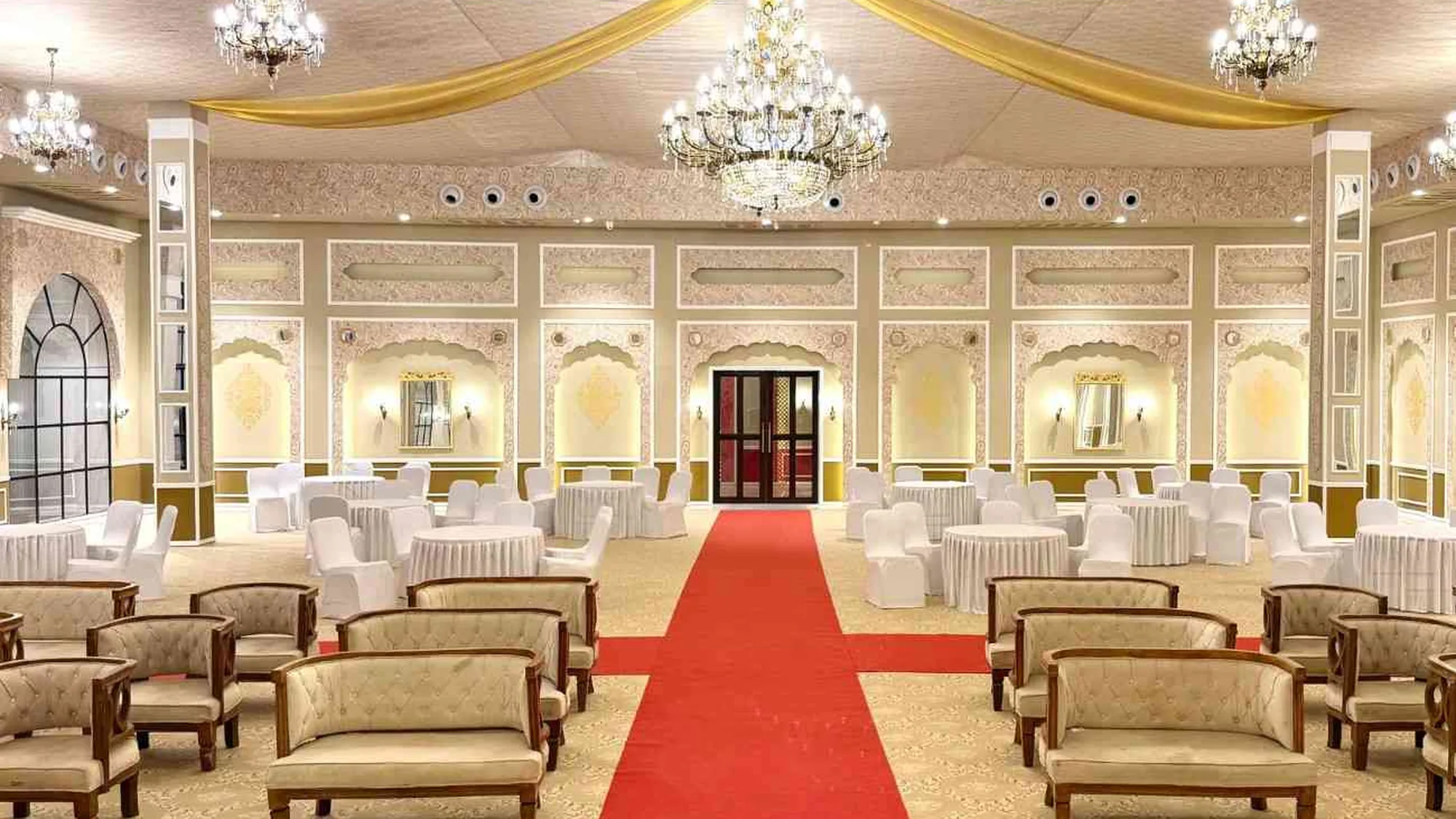 The grand banquet hall beneath its chandeliers